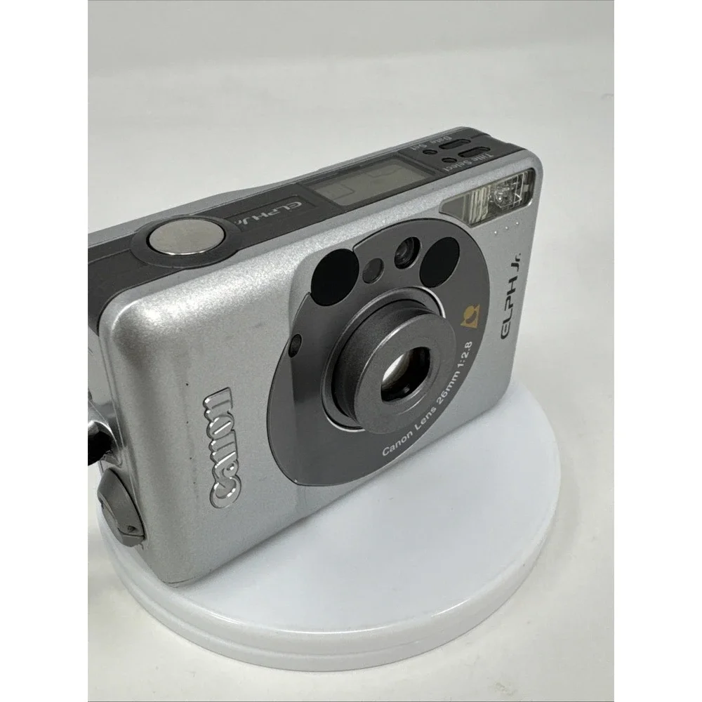 CANON Elph Jr. APS Film Camera, 26mm‎ f2.8 Wide Angle Lens, Silver w/ Case WORKS